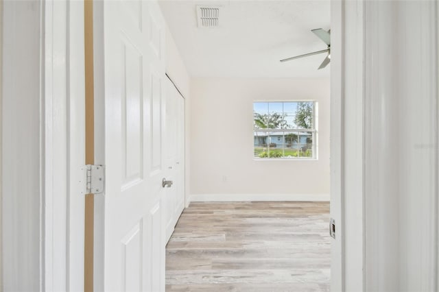 unfurnished bedroom featuring ceiling fan and light hardwood / wood-style floors