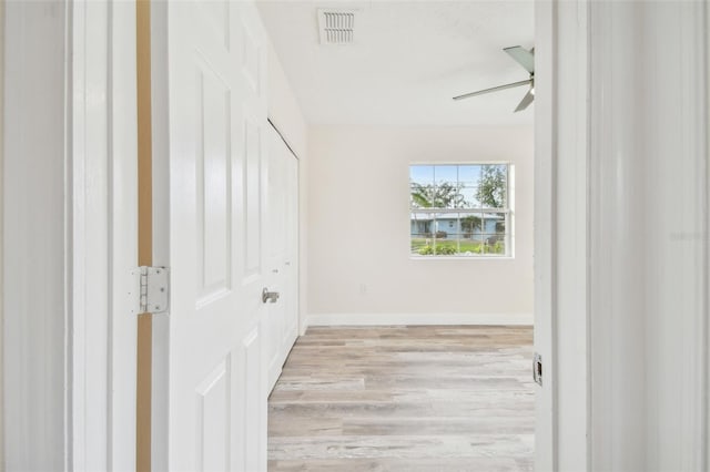 831 Searcy Ave, Sarasota, FL 34237 - hallway featuring light wood-style flooring and baseboards
