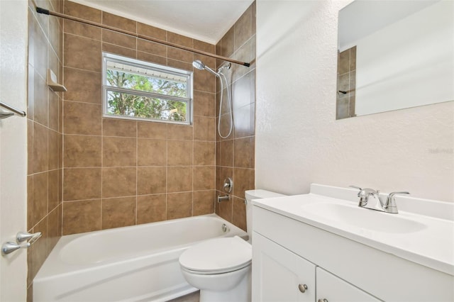 full bathroom featuring vanity, toilet, and tiled shower / bath