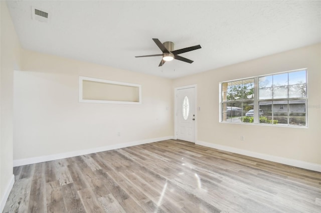 entryway with ceiling fan and light wood-type flooring