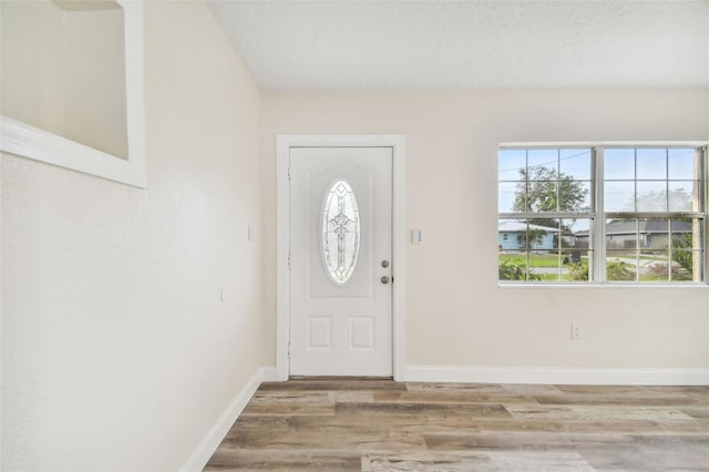 831 Searcy Ave, Sarasota, FL 34237 - foyer featuring wood finished floors and baseboards