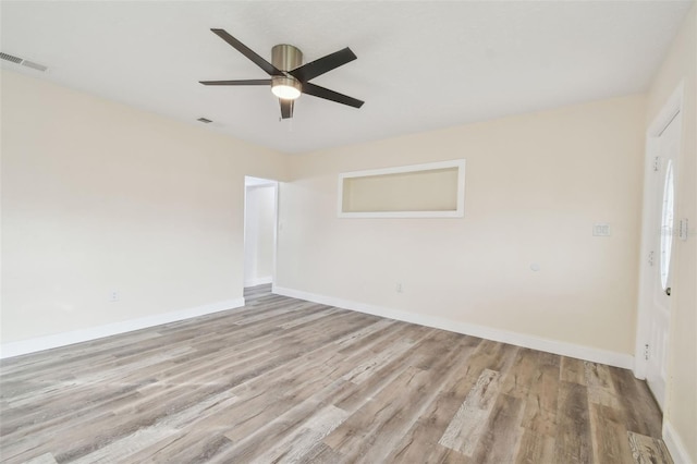 unfurnished room with ceiling fan and light hardwood / wood-style flooring