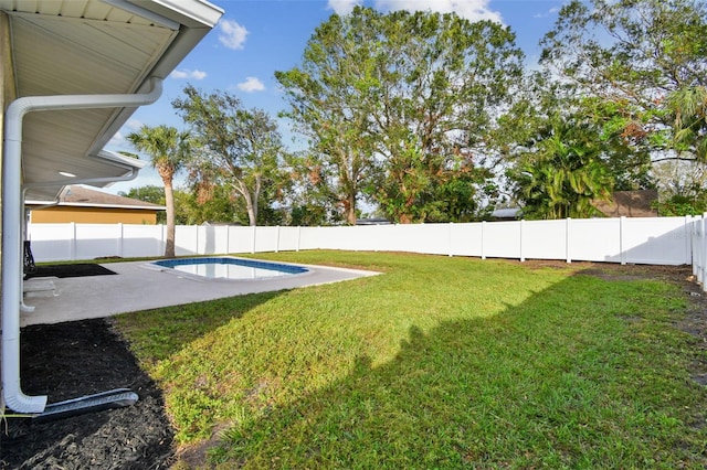 view of yard featuring a patio and a fenced in pool