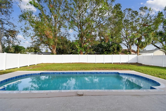 view of pool featuring a lawn