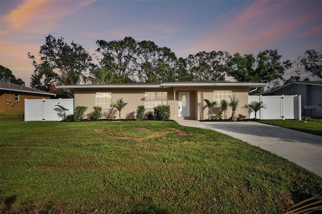 ranch-style house featuring a yard