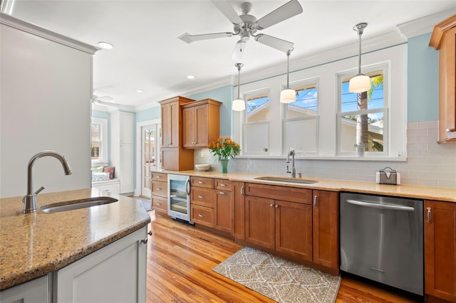 kitchen featuring sink, light hardwood / wood-style flooring, dishwasher, and wine cooler