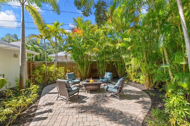 view of patio with an outdoor fire pit