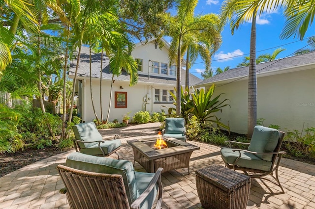 view of patio / terrace featuring an outdoor fire pit