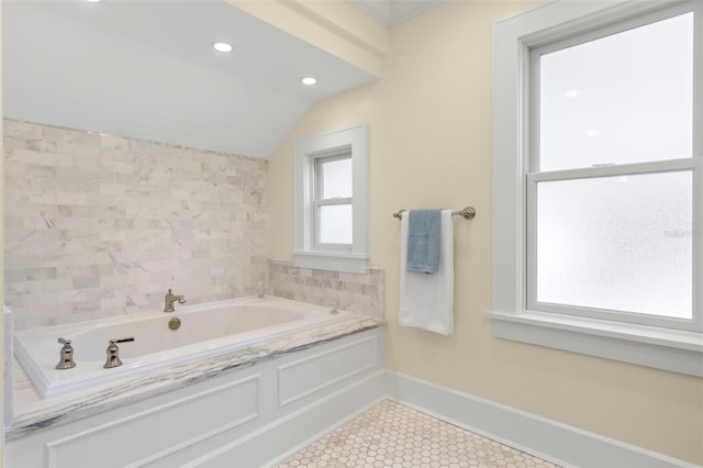 bathroom featuring a bath and tile patterned flooring