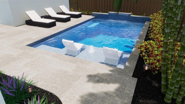 view of swimming pool with a patio area