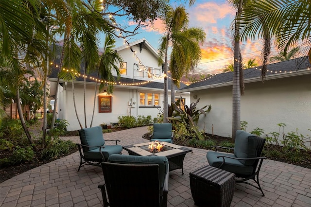 patio terrace at dusk with an outdoor fire pit