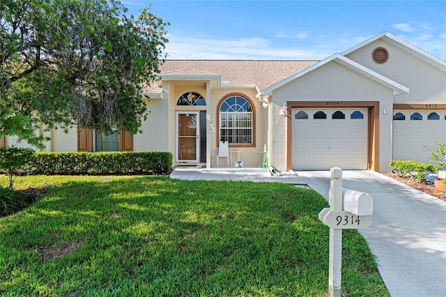 single story home with a front lawn and a garage