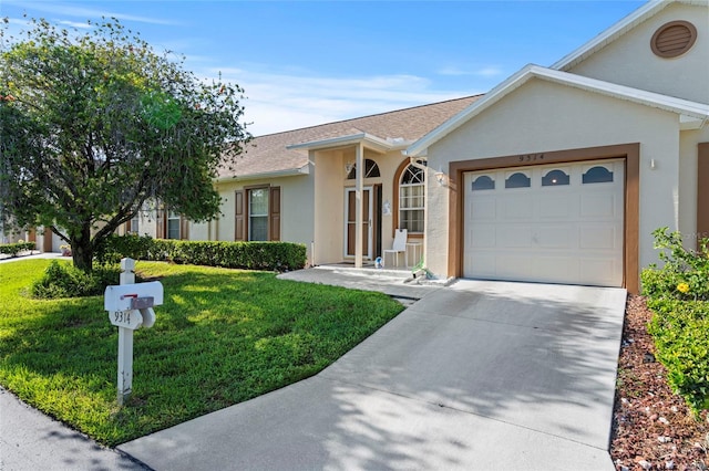 ranch-style home featuring a garage and a front lawn