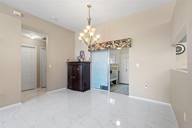 dining space featuring a chandelier and light tile patterned floors