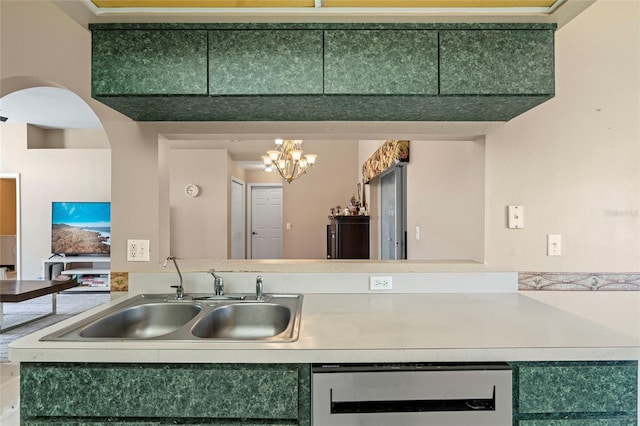 kitchen with green cabinets, sink, a notable chandelier, and dishwasher