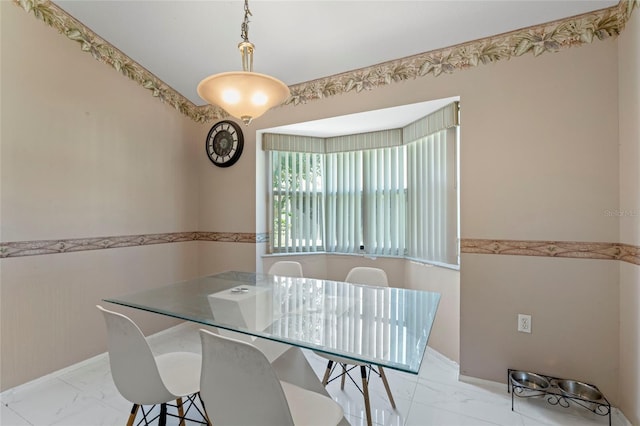 dining area featuring light tile patterned floors