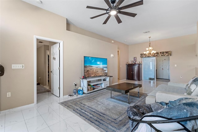 living room featuring ceiling fan with notable chandelier and light tile patterned flooring