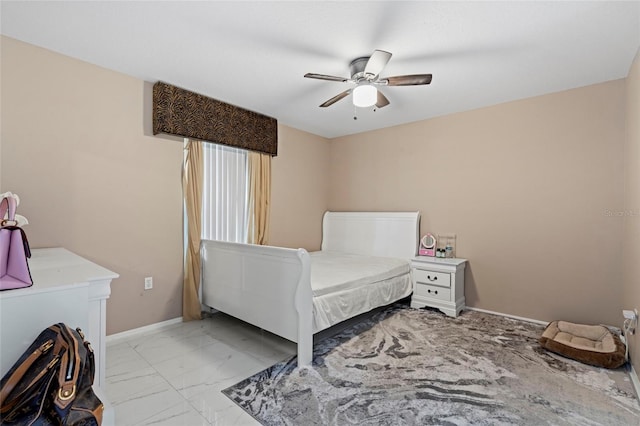 bedroom with ceiling fan and light tile patterned flooring