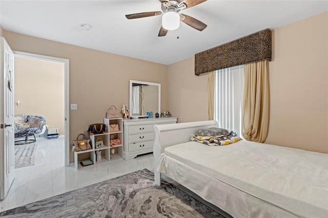 bedroom with ceiling fan and light tile patterned flooring