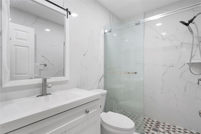 bathroom with toilet, an enclosed shower, and vanity