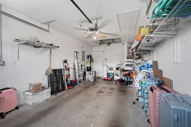 garage featuring ceiling fan, a garage door opener, electric panel, and radiator