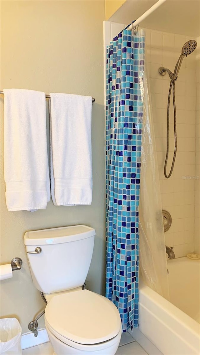 bathroom with toilet, shower / bathtub combination with curtain, and tile patterned flooring