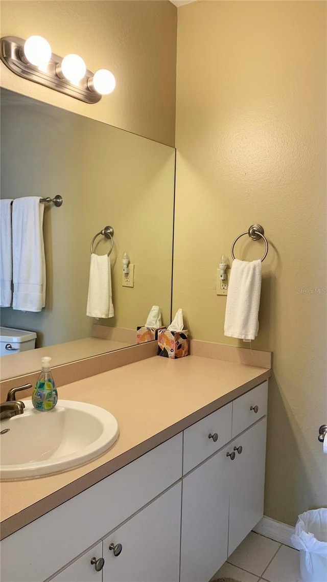 bathroom with tile patterned floors and vanity