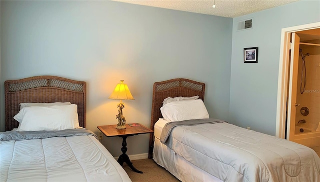 carpeted bedroom with a textured ceiling