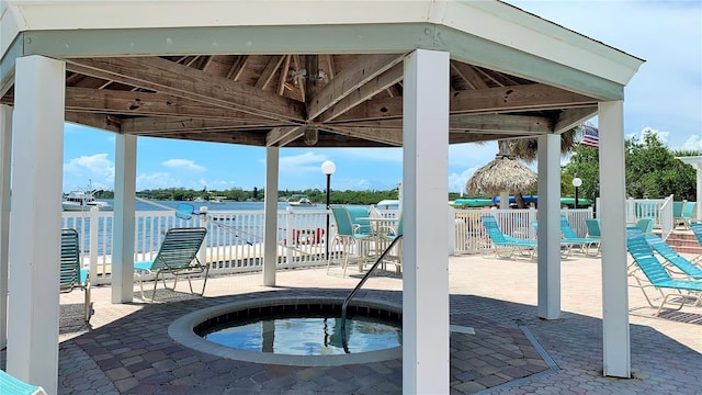 view of pool with a patio area, a gazebo, and a hot tub