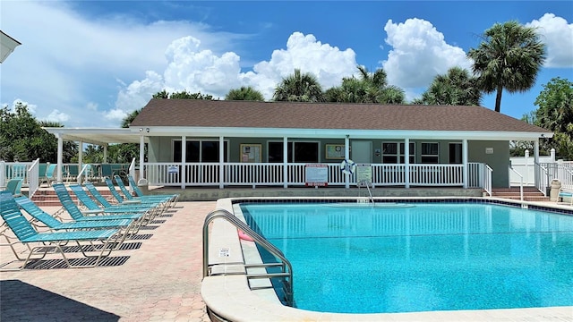 view of swimming pool with a patio