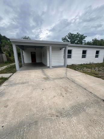 exterior space featuring a carport