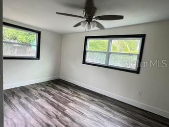 spare room featuring ceiling fan and hardwood / wood-style floors