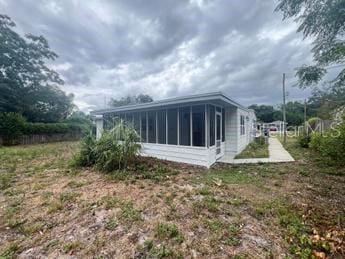 rear view of house with a sunroom