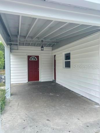 garage featuring central AC and a carport