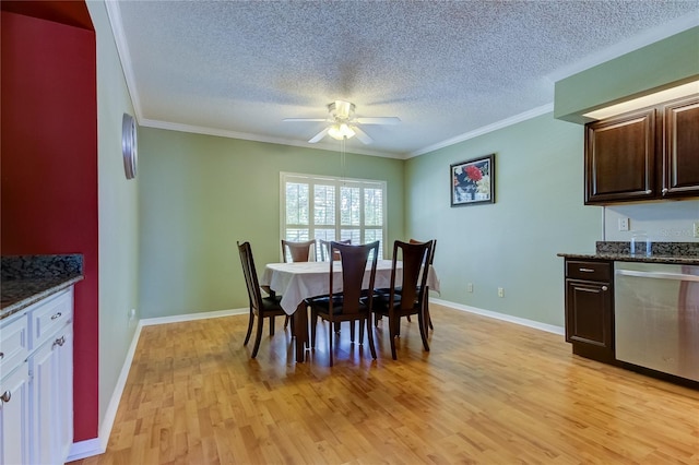 dining area with ornamental molding, ceiling fan, a textured ceiling, and light wood-type flooring