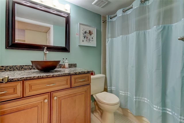 bathroom featuring vanity, curtained shower, tile patterned floors, and toilet