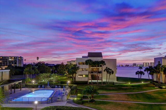 pool at dusk with a water view