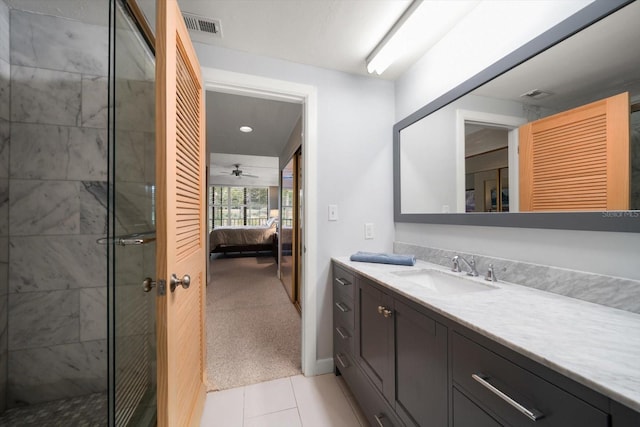 bathroom featuring visible vents, a stall shower, vanity, ensuite bath, and tile patterned flooring