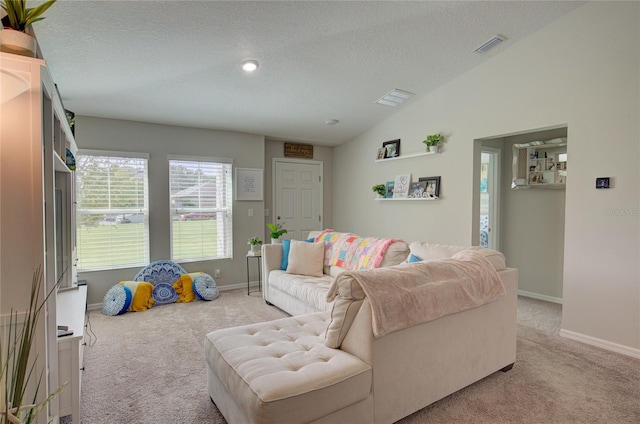 living room with lofted ceiling, a textured ceiling, light carpet, and baseboards