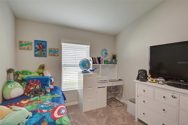 bedroom featuring baseboards, vaulted ceiling, and light colored carpet