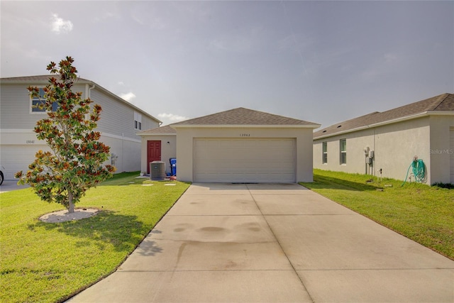 view of front of property featuring driveway, roof with shingles, cooling unit, a front lawn, and stucco siding