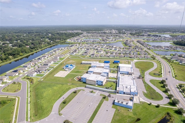 bird's eye view with a water view and a residential view