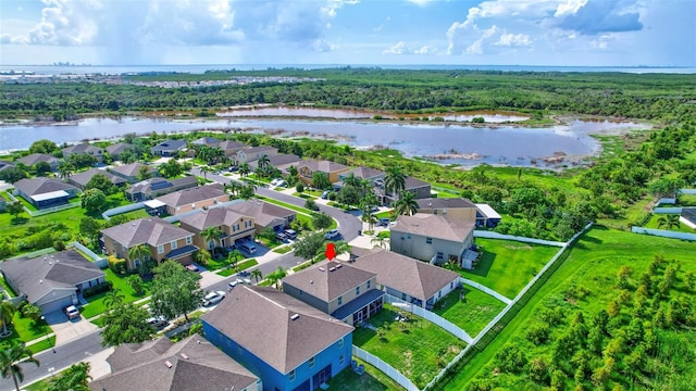 drone / aerial view with a water view