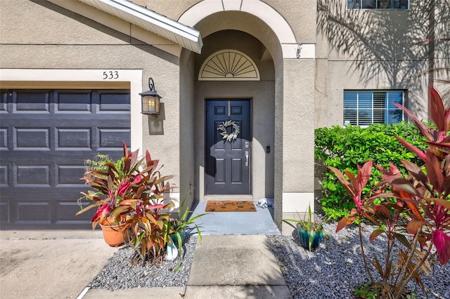 property entrance with a garage