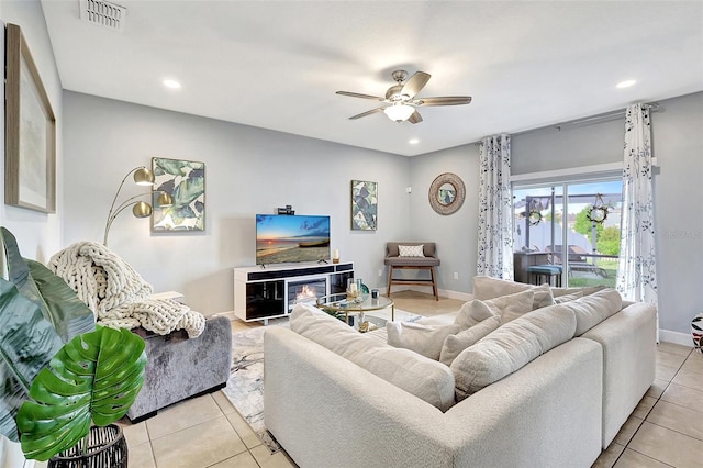 tiled living room featuring ceiling fan