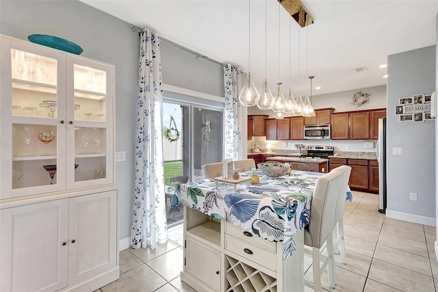 dining space with light tile patterned floors