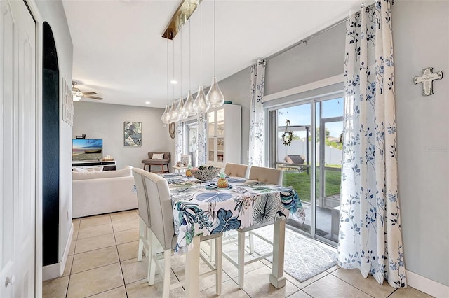 tiled dining area with ceiling fan