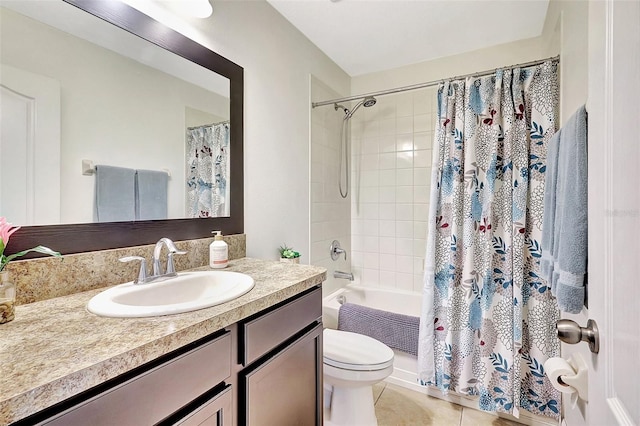 full bathroom featuring tile patterned floors, vanity, toilet, and shower / bath combination with curtain