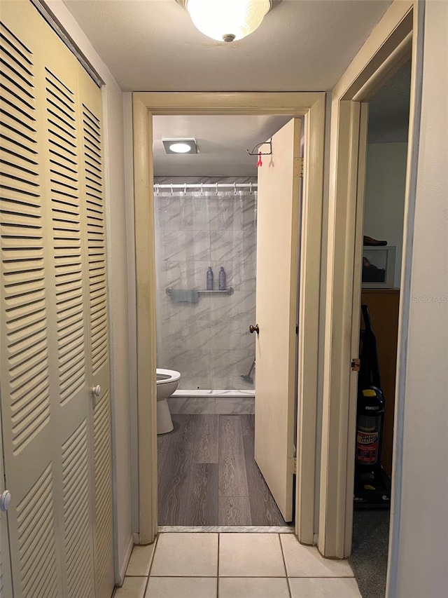 hallway with light hardwood / wood-style flooring