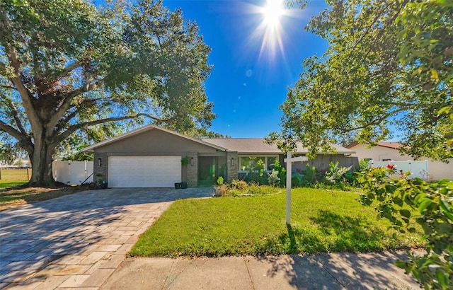 ranch-style house with a front lawn and a garage